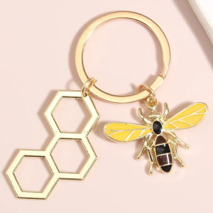 Portachiavi Ape Esagono Dorato – Minimalismo e Natura