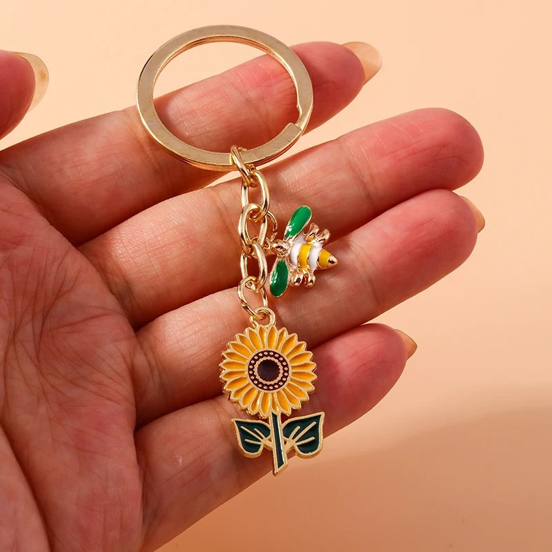 Portachiavi Ape Donna e Girasole – Elegante e Originale