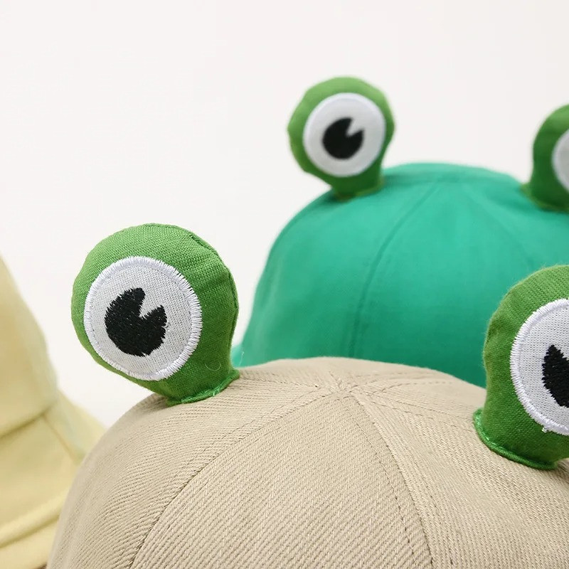 Cappello Rana 'Curio'Zampette' – Divertente in 4 Colori