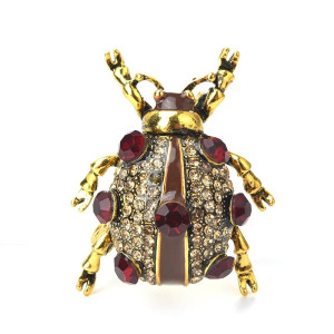 Spilla Scarabeo Granato – Gioiello Elegante e Dorato