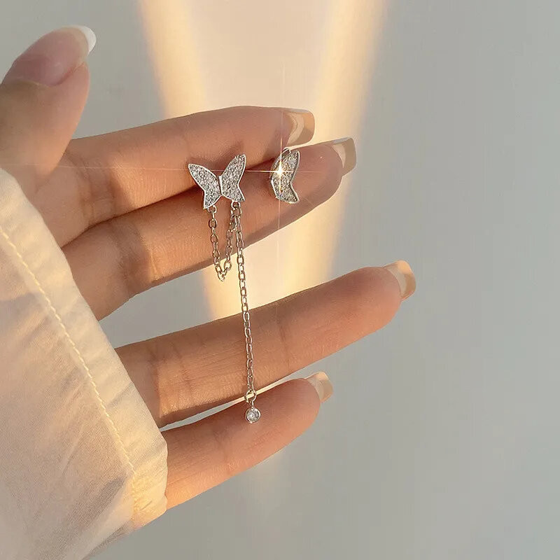 Boucles d'oreilles papillon en argent avec demi-aile
