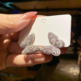 Boucles d'oreilles papillon ailes fines avec strass couleur argent