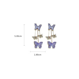 dimensions Boucles d'oreilles papillons mauve et or