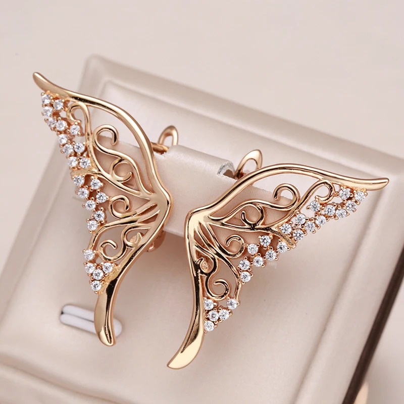 Boucles d'oreilles papillon deux grandes aildes papillon strass et or rose