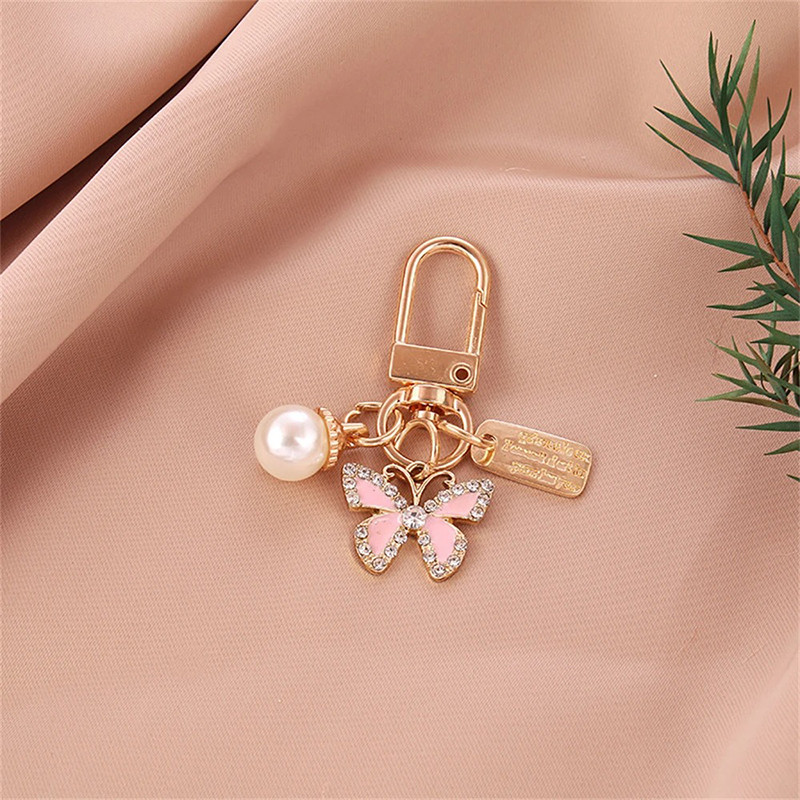 Porte-clés papillon en strass avec perle - modèle 3