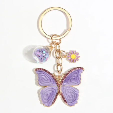 Porte-clés papillon violet avec perles de verre étoilées et fleurs