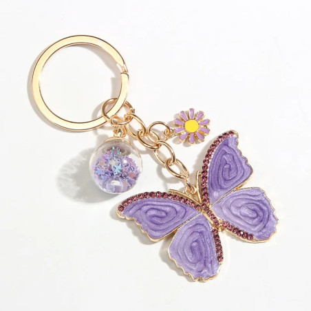 vue complète Porte-clés papillon violet avec perles de verre étoilées et fleurs
